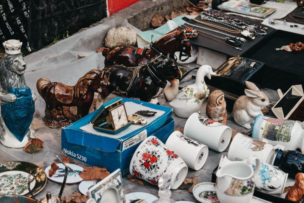Various vintage items laid out at a market stall